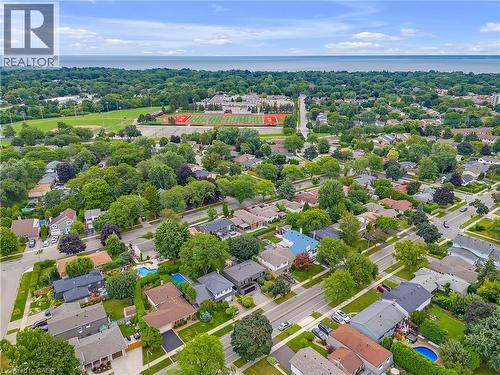 Aerial perspective of a residential neighborhood with mature trees, established streets, and consistent housing styles - 4236 Longmoor Drive, Burlington, ON 