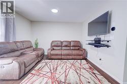 Recessed ceiling lighting, wood-finish flooring, and light-toned wall paint - 