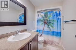 Built-in vanity with an integrated sink, polished chrome faucet, and framed mirror - 
