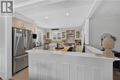 Kitchen with recessed lighting, stainless steel appliances, light-toned cabinetry, and a butcher block countertop - 1434 Dewbourne Crescent, Burlington, ON 