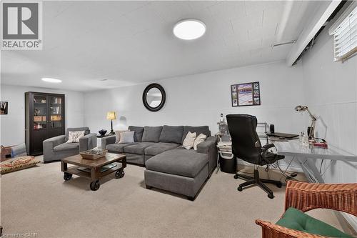 Wall-to-wall carpeting, recessed lighting, and a window with blinds provide illumination - 1434 Dewbourne Crescent, Burlington, ON 