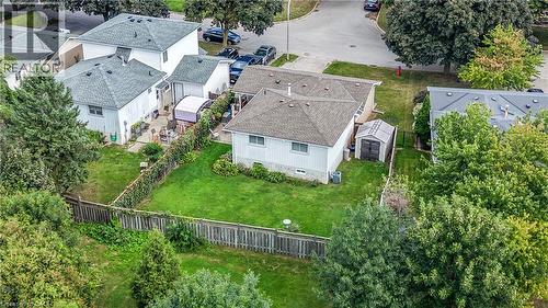 Expansive backyard featuring a manicured lawn, established perimeter fencing, and mature trees - 1434 Dewbourne Crescent, Burlington, ON 