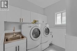 Main Floor Laundry with Garage Access - 