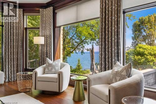 Hardwood flooring and floor-to-ceiling windows with custom drapery - 4038 Lakeshore Road, Burlington, ON 
