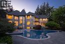 Stone exterior with a turret feature and multiple large windows - 4038 Lakeshore Road, Burlington, ON 