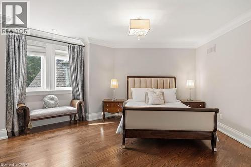 Hardwood flooring, crown molding, double window with trim, ceiling-mounted light fixture - 4038 Lakeshore Road, Burlington, ON 