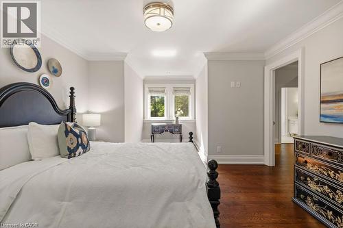 Hardwood flooring, crown molding, cased doorway, recessed window, and flush mount lighting - 4038 Lakeshore Road, Burlington, ON 