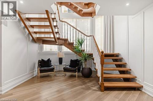 Open riser staircase with wood treads and white balusters - 4038 Lakeshore Road, Burlington, ON 