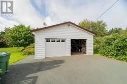 24 ft by 24 ft fully wired garage with own electrical meter - 