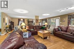 Hardwood flooring, painted walls, track lighting, and a glass-paneled exterior door - 