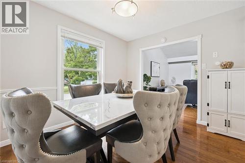 Hardwood flooring, painted trim, and a built-in storage cabinet - 21 Colebrook Court, Kitchener, ON 