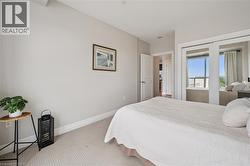 Recessed lighting, light gray wall paint, and carpeted flooring - 