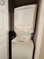 White stacked washer and dryer unit - 