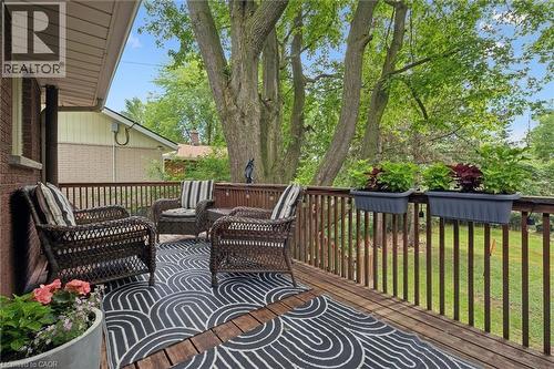 Wood-finish outdoor deck featuring a coordinating wood-finish railing system - 135 Bridge Street W, Waterloo, ON 