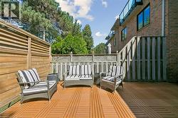Private outdoor deck featuring wood-finish flooring - 