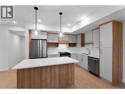 Please note photos are of Unit 107 with same kitchen colour scheme, flooring, and appliances. - 