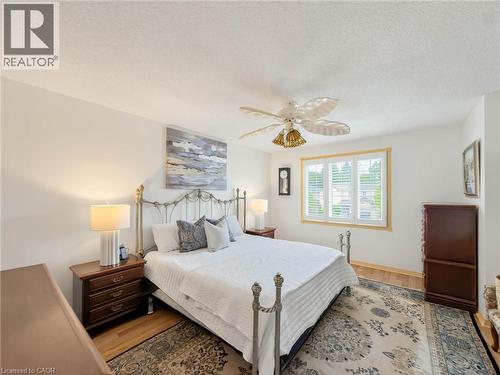 Hardwood flooring and crisp white walls provide a neutral backdrop - 1236 Thorpe Road, Burlington, ON 
