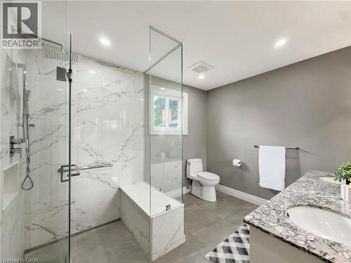 Walk-in shower with full-height glass enclosure, integrated bench, and niche - 1236 Thorpe Road, Burlington, ON 