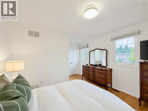 White walls with wood-finish flooring - 1236 Thorpe Road, Burlington, ON 