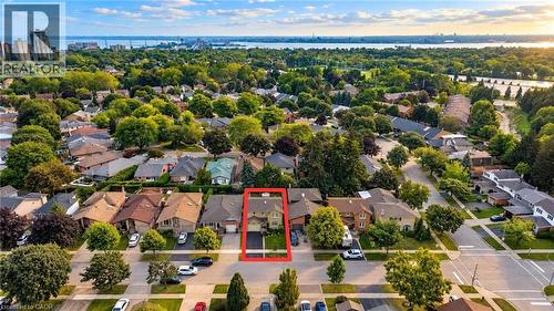 Aerial perspective of a residential neighborhood featuring mature trees and a distant body of water - 1236 Thorpe Road, Burlington, ON 