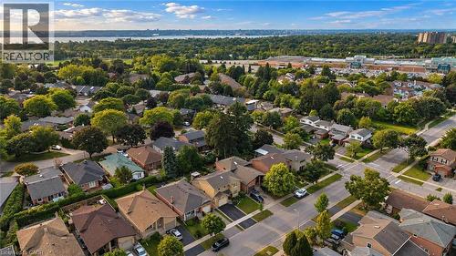 Residential neighborhood featuring mature trees, paved streets, and a distant body of water - 1236 Thorpe Road, Burlington, ON 