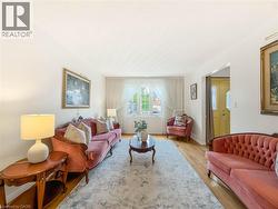 Hardwood flooring, white walls, and a prominent window - 