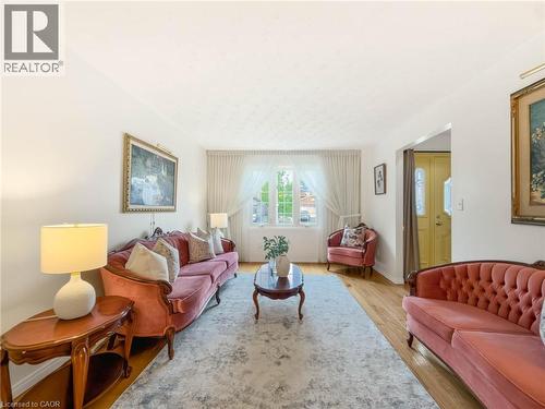 Hardwood flooring, white walls, and a prominent window - 1236 Thorpe Road, Burlington, ON 