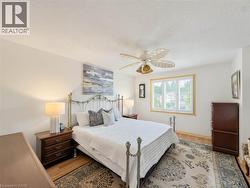 Hardwood flooring and crisp white walls provide a neutral backdrop - 