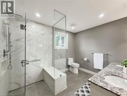 Walk-in shower with full-height glass enclosure, integrated bench, and niche - 