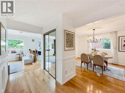 Hardwood flooring, mirrored closet doors, and wainscoting details - 1236 Thorpe Road, Burlington, ON 