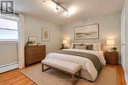 Apt 1 Lower Level - Bedroom (Virtually Staged) - 