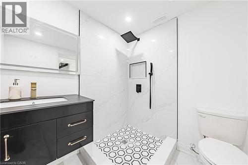 Spacious shower with hex-tile flooring and a built-in niche - 4511 Guelph Line, Burlington, ON 