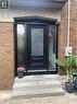 Brick exterior with concrete steps and a covered entry - 90 Brock Street, Kitchener, ON 