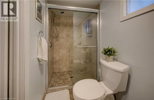 Glass-enclosed shower with tiled walls and floor - 90 Brock Street, Kitchener, ON 