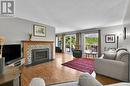 Living room ft. gas fireplace and large windows - 2555 Regina Street, Ottawa, ON 