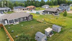 LARGE BACKYARD WITH STORAGE SHEDS/WOOD SHED - 