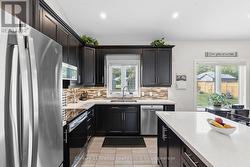 LARGE KITCHEN WITH PLENTY OF CUPBOARD SPACE - 