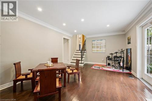 Hardwood flooring, recessed lighting, crown molding, double French doors, and a staircase with wrought iron balusters - 334 Coleridge Drive, Waterloo, ON 
