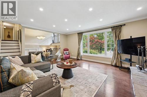 Hardwood-style flooring, large picture window, recessed lighting, and crown molding - 334 Coleridge Drive, Waterloo, ON 