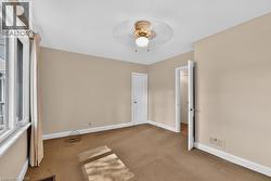 Neutral-toned walls complement the carpeted flooring - 
