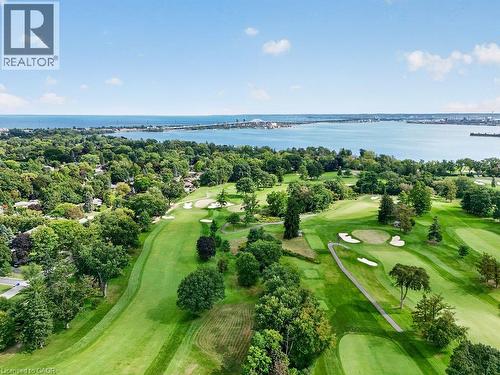 Expansive golf course setting featuring manicured greens, sand bunkers, and mature trees - 948 Long Drive, Burlington, ON 