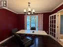 Room featuring a multi-light chandelier, crown molding, dark wood-finish flooring, and French doors with privacy glass - 450 Bridge Street W, Waterloo, ON 