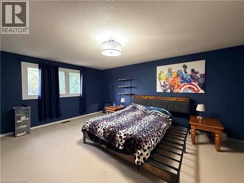 Recessed lighting, light-colored carpeting, and a built-in wall shelf - 450 Bridge Street W, Waterloo, ON 
