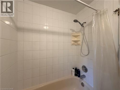 White tiled shower surround with an integrated bathtub - 450 Bridge Street W, Waterloo, ON 
