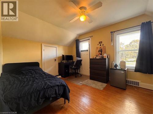 Hardwood flooring, painted walls, ceiling fan with integrated lighting, and window with natural light - 225 Bridgeport Road E, Waterloo, ON 