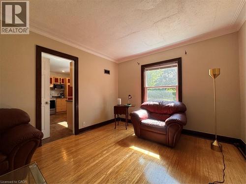 Wood-finish flooring with dark trim - 225 Bridgeport Road E, Waterloo, ON 