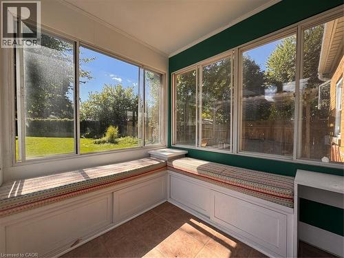Sunroom featuring full-height windows, built-in bench seating, and tiled flooring - 225 Bridgeport Road E, Waterloo, ON 