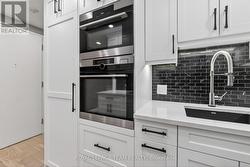 Hidden refrigerator; double wall ovens - 