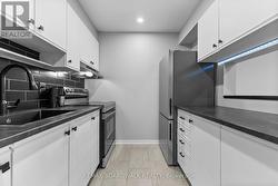 Modern black and white kitchen with ss appliances - 