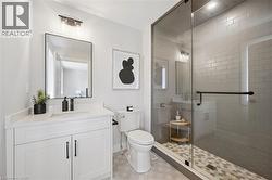 White vanity with a single sink, black faucet, and white countertop - 